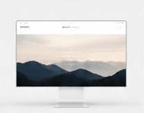 Desktop website design with mountain landscape